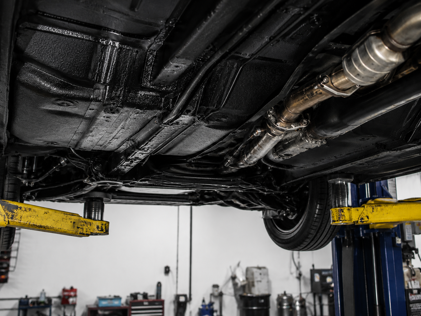 Truck on a lift being undercoated — vehicle undercoating Wilmington NC, truck undercoating